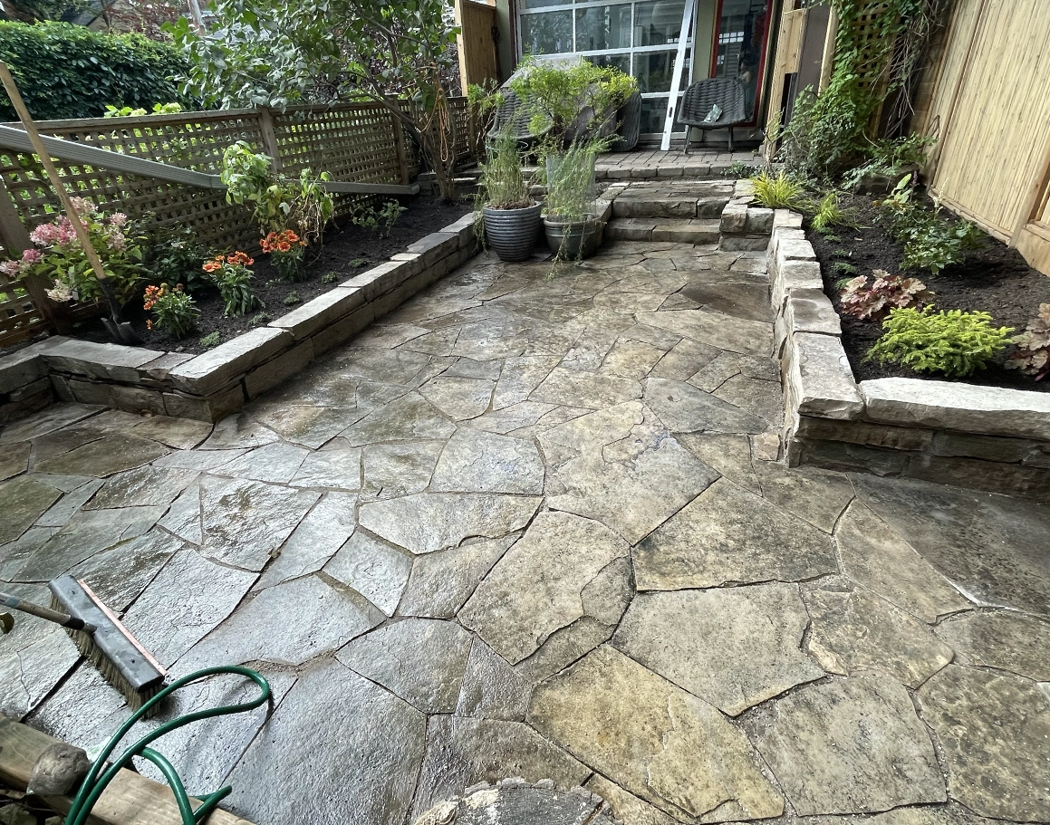 Stone Patio + Bamboo Fence